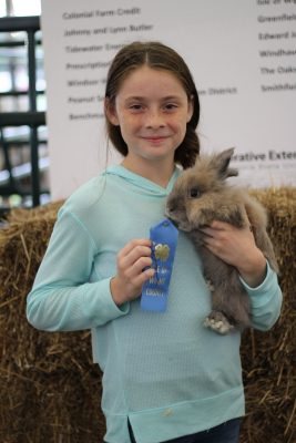 4-H youth with her award winning rabbit